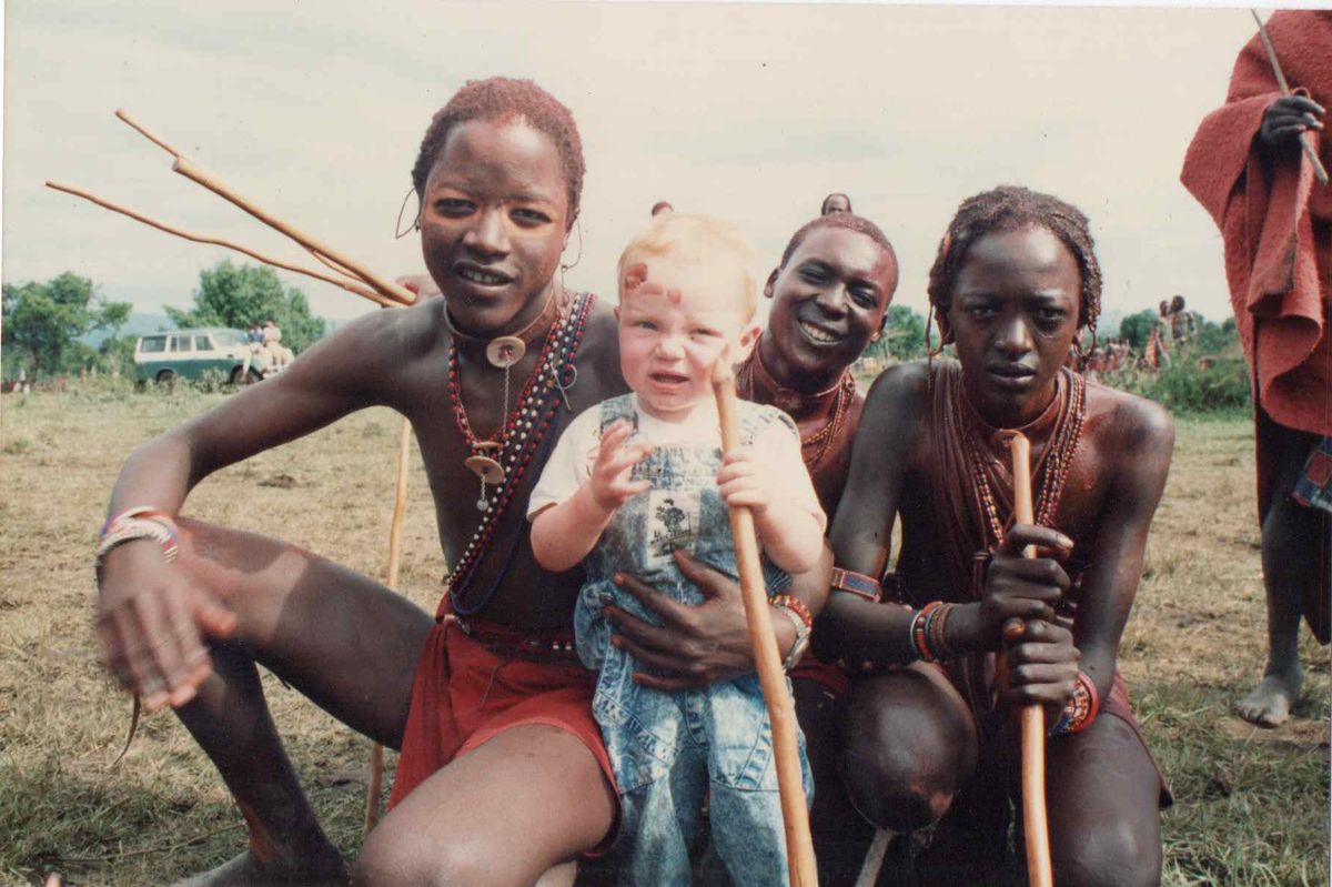 Ali's son Oliver with the Masai warriors on a trip to Kenya