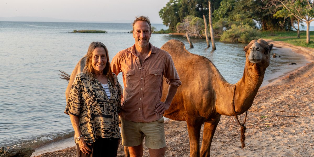 Ali and Ben on the beach with one of Ali's camels