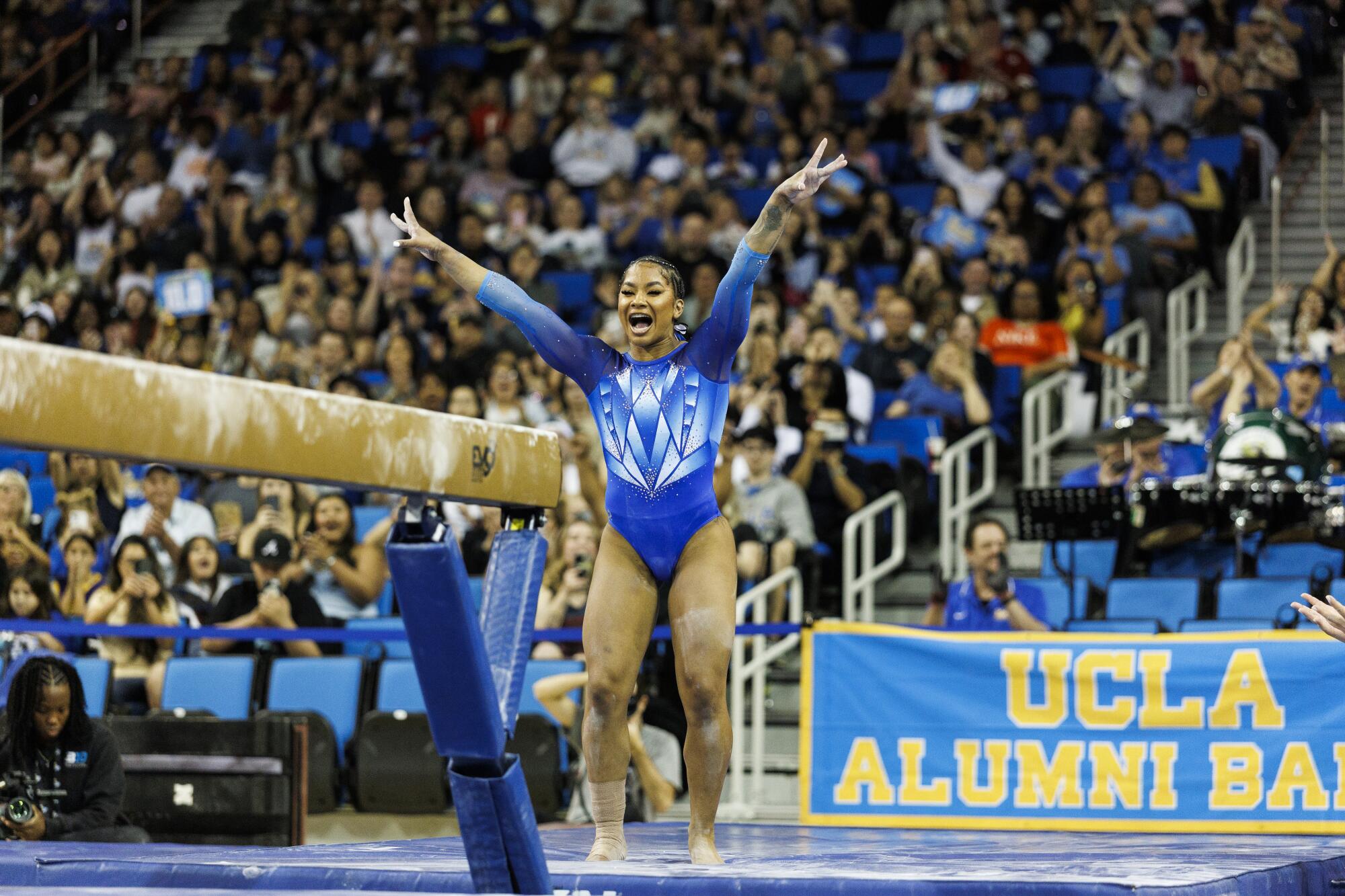 UCLA's Jordan Chiles celebrates after her dismount on the balance beam during a meet against Nebraska.