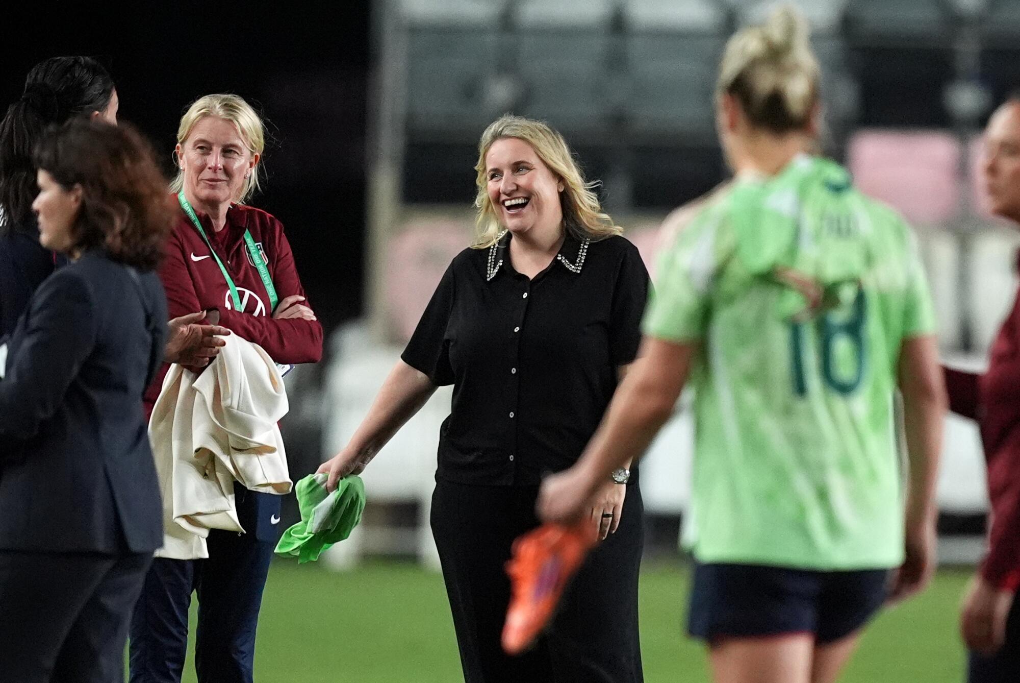 U.S. coach Emma Hayes, center, speaks with players after an international friendly match against Italy in December.