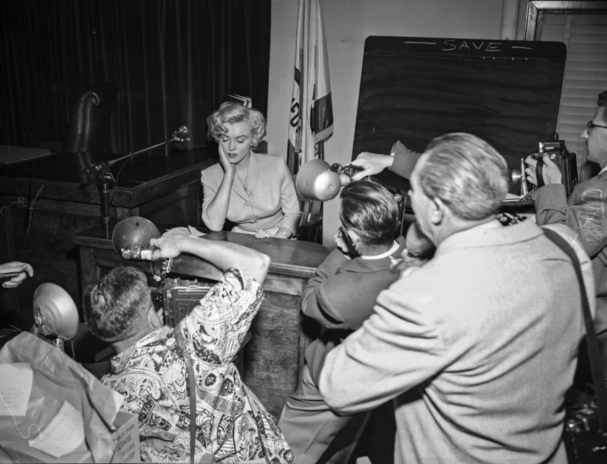 Marilyn Monroe in court testifying against men accused of trying to sell “indecent” photos of her.