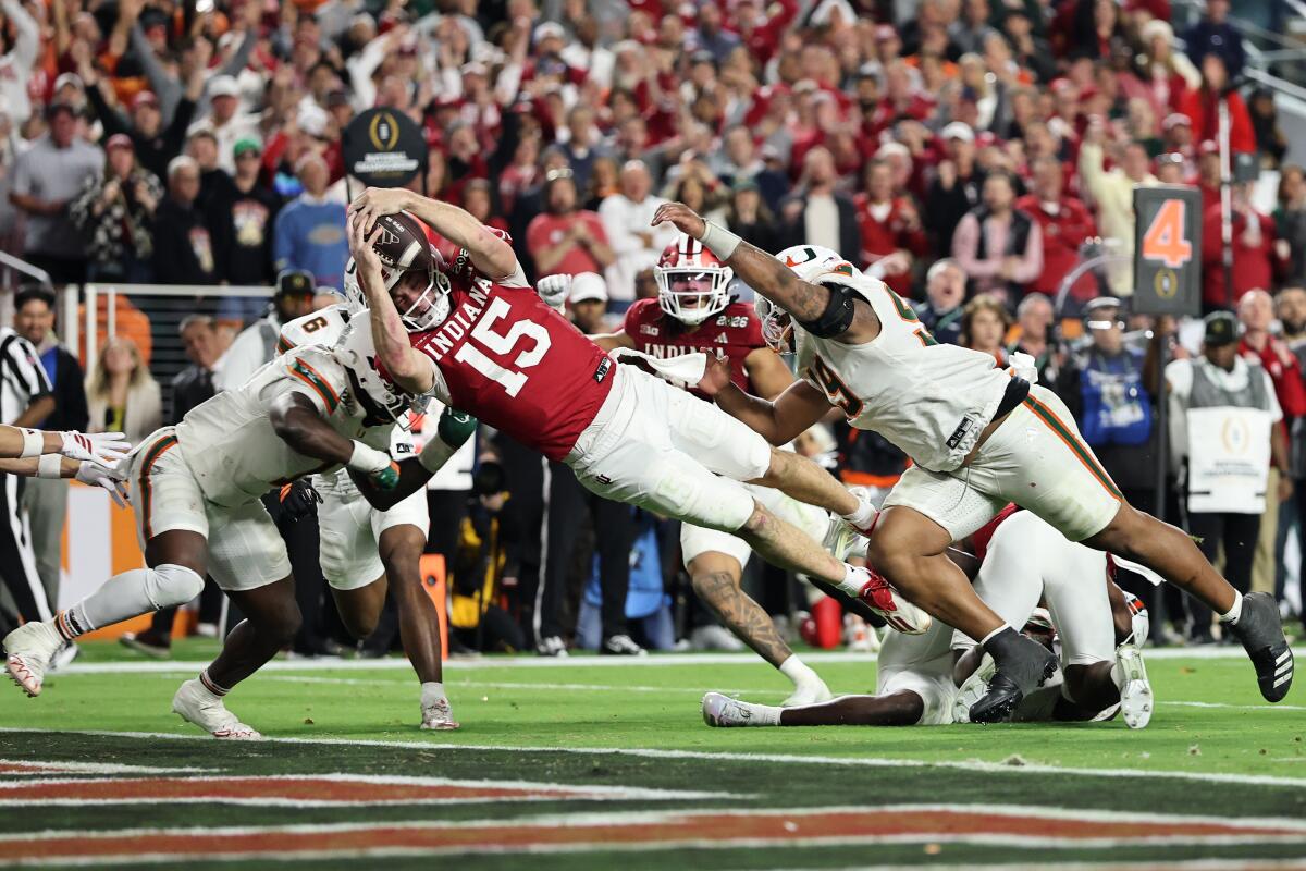 Indiana quarterback Fernando Mendoza dives across the goal line for a touchdown.