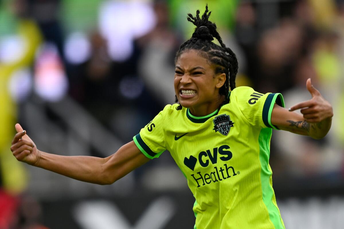 Washington Spirit midfielder Croix Bethune celebrates after scoring a goal.