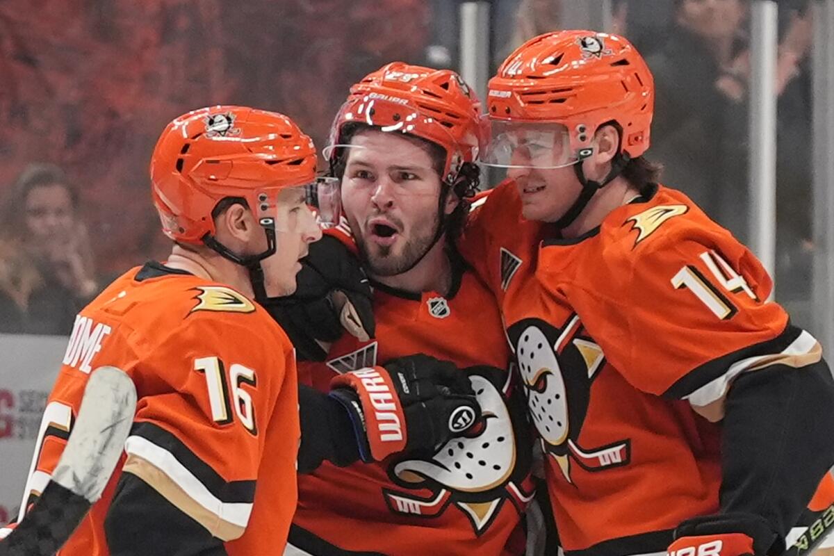 Anaheim Ducks center Mason McTavish, center, celebrates his goal with teammates.
