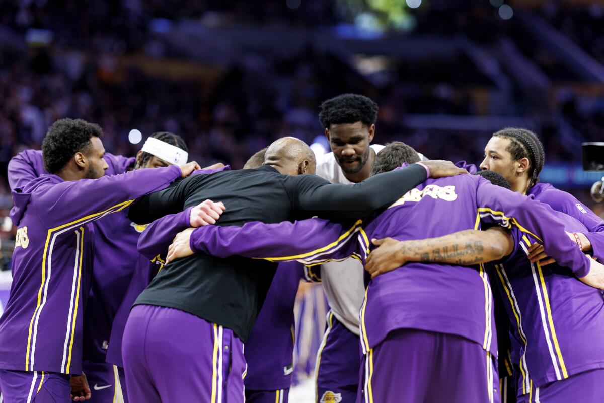 Lakers players huddle before a game against the Milwaukee Bucks at Crypto.com Arena on Jan. 9.