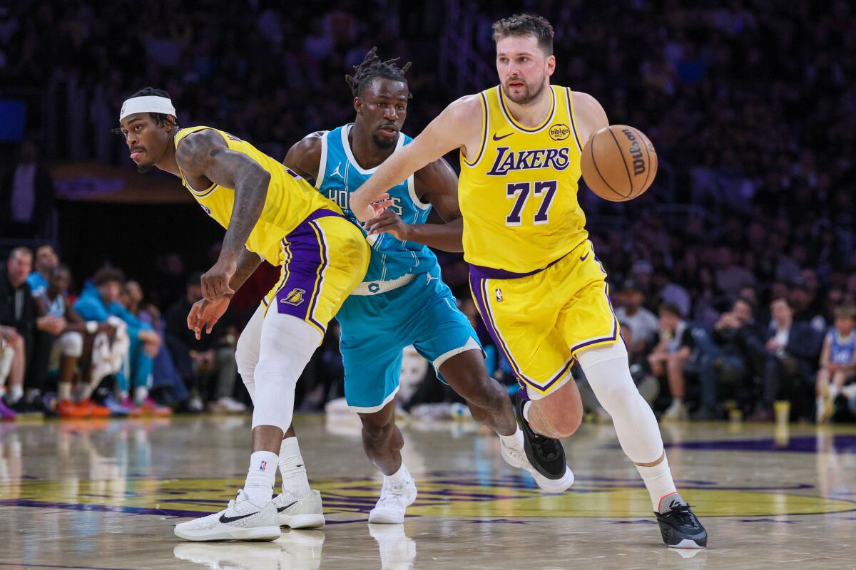 Lakers star Luka Doncic drives toward the basket as teammate Jarred Vanderbilt sets a screen.