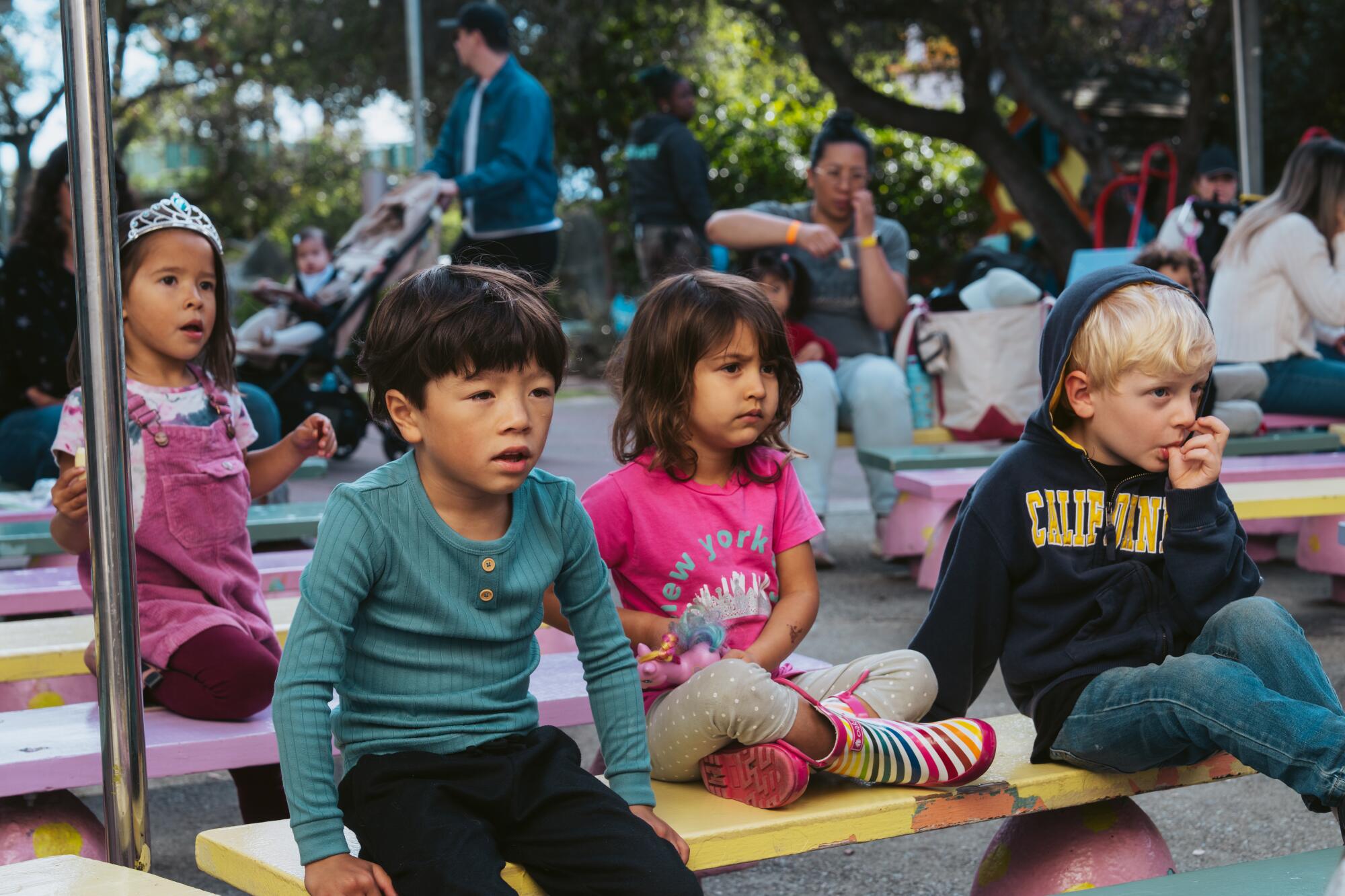 Kids take in a puppet show at Children's Fairyland. The park runs multiple shows per day.