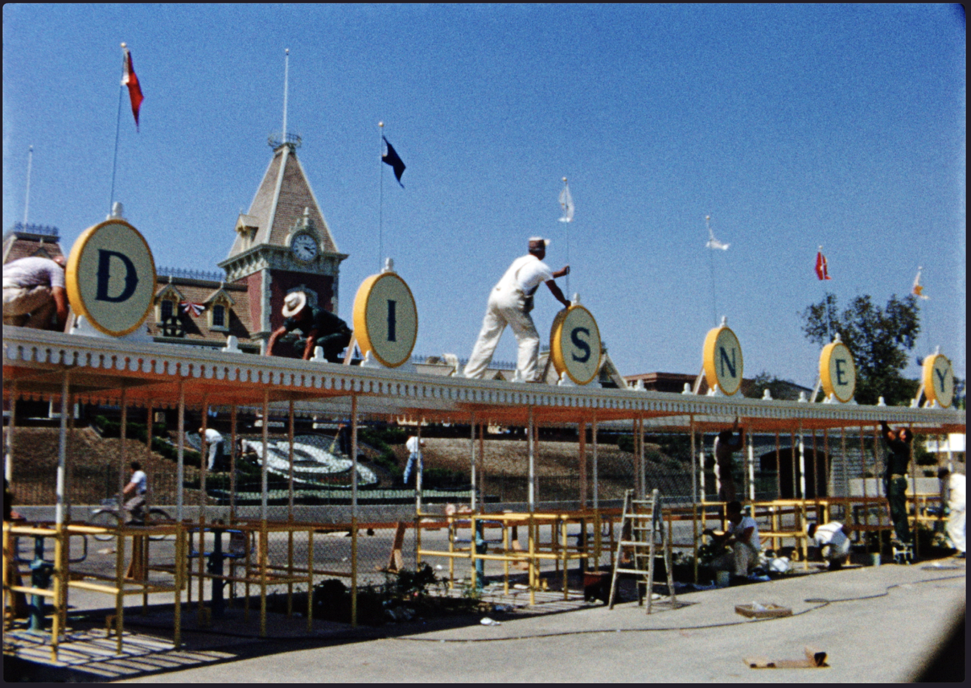 The front gates of Disneyland under construction.