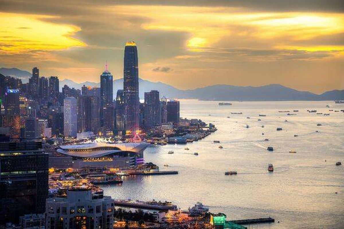 Hong Kong Skyline At Sunset Over Victoria Harbour