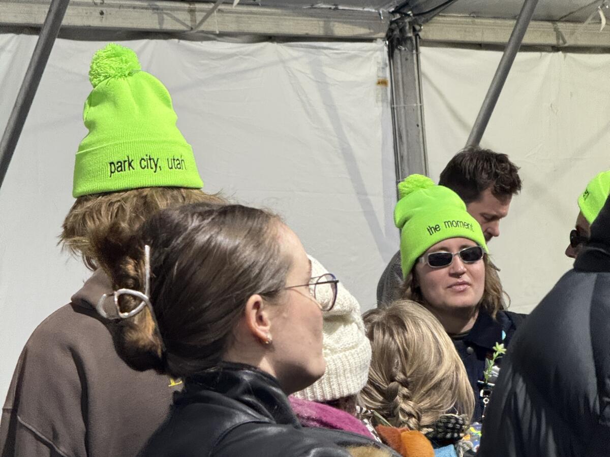 Fans in brat wear wait at the Eccles Theatre for the world premiere of Charli XCX's "The Moment."
