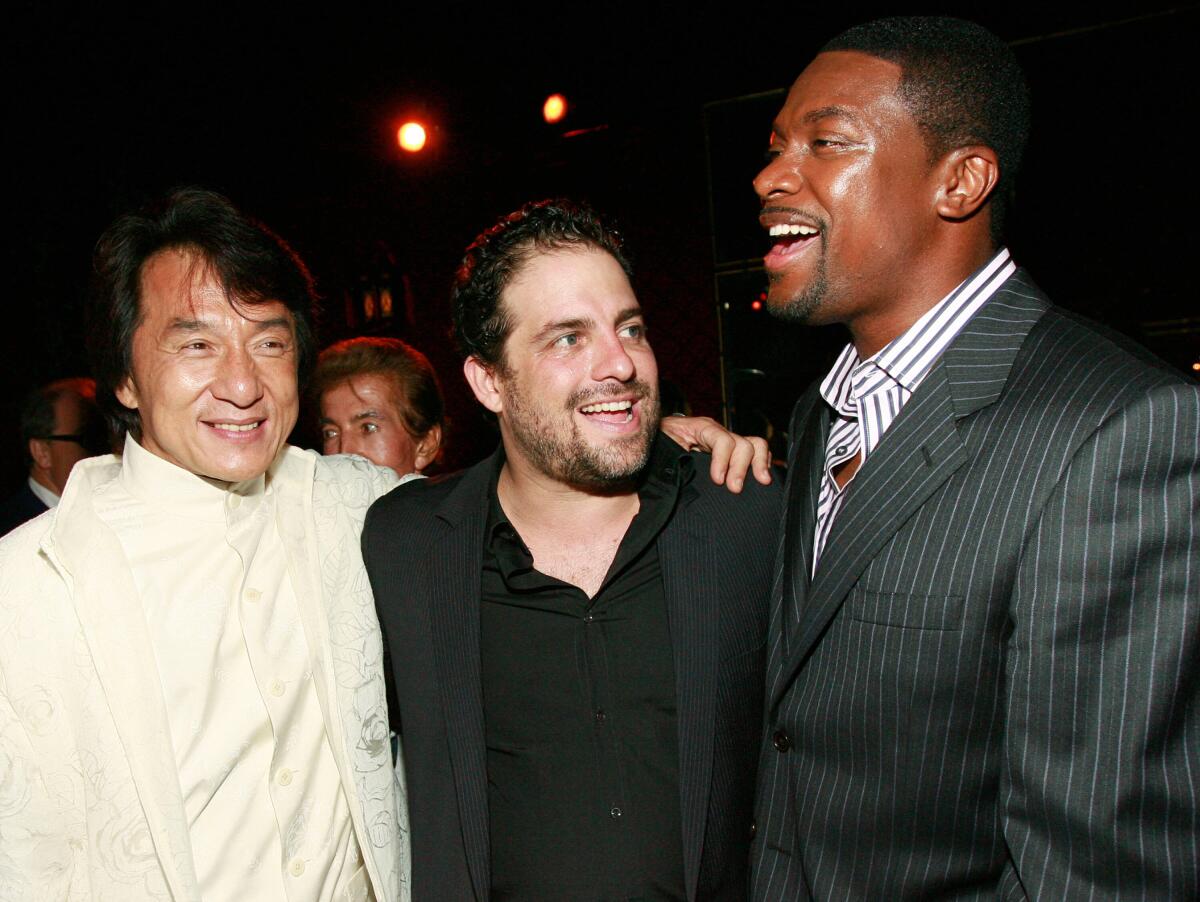 Jackie Chan, from left, Brett Ratner and Chris Tucker appear at the "Rush Hour 3" premiere after party in Los Angeles 2007. 