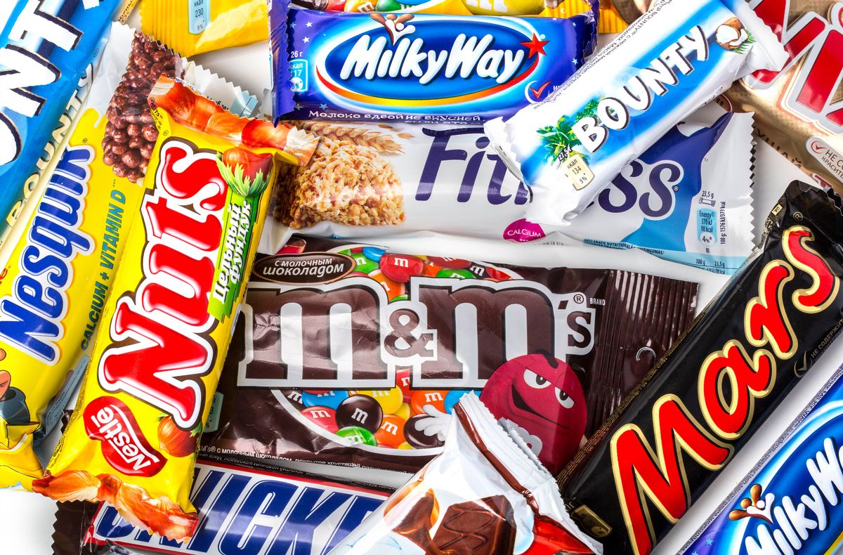 A pile of various chocolate bars, which some can be found in moldavian and some international.