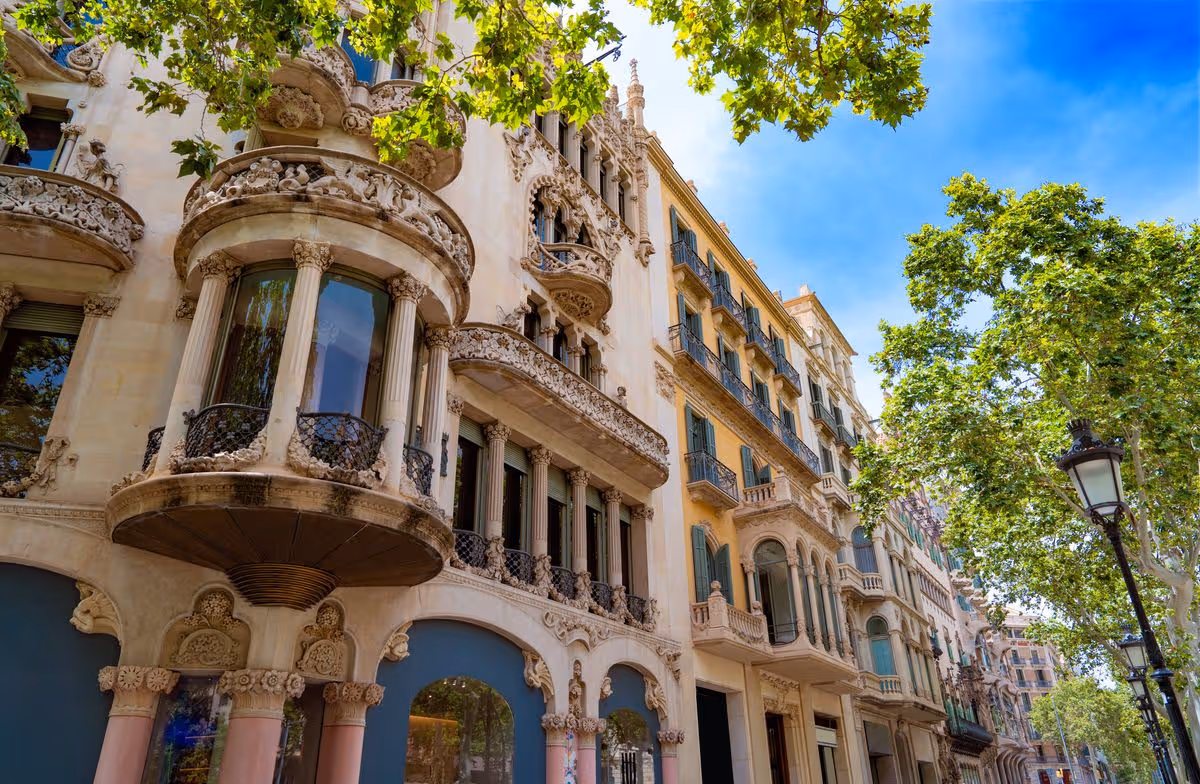 Paseo de Gracia Passeig avenue Eixample barrio in Barcelona downtown Catalonia of Spain. Showcasing its vibrant architecture and leafy avenues during a sunny day