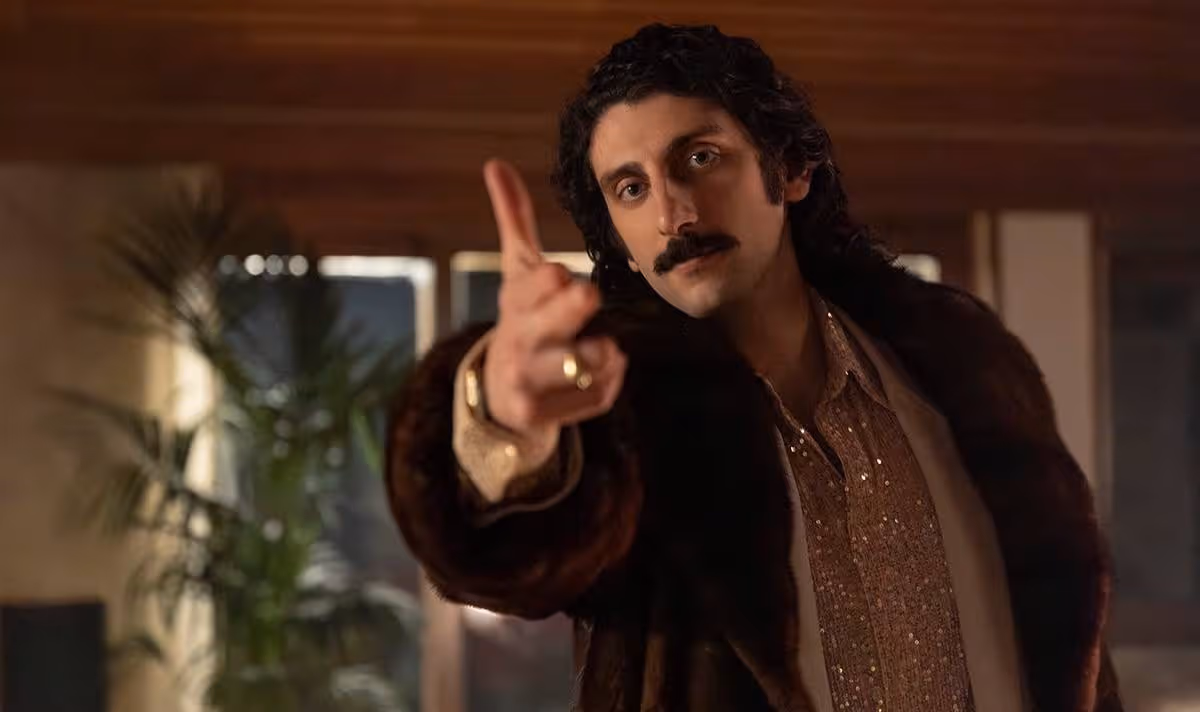 A man holds his hand up mimicking a gun