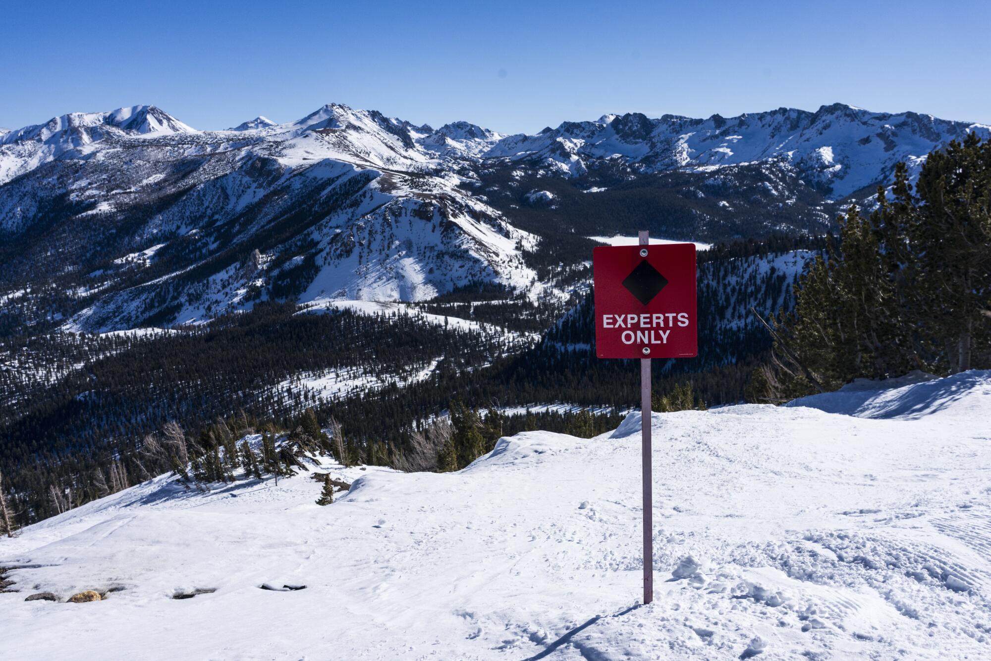 Signs on top of Lincoln Mountain at Mammoth advise skiers that the runs are for experts only.