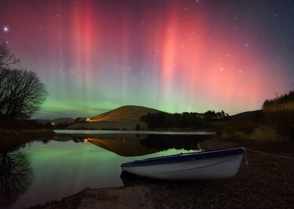 Image of extremely strong aurora over Castlehill Reservoir, Scotland