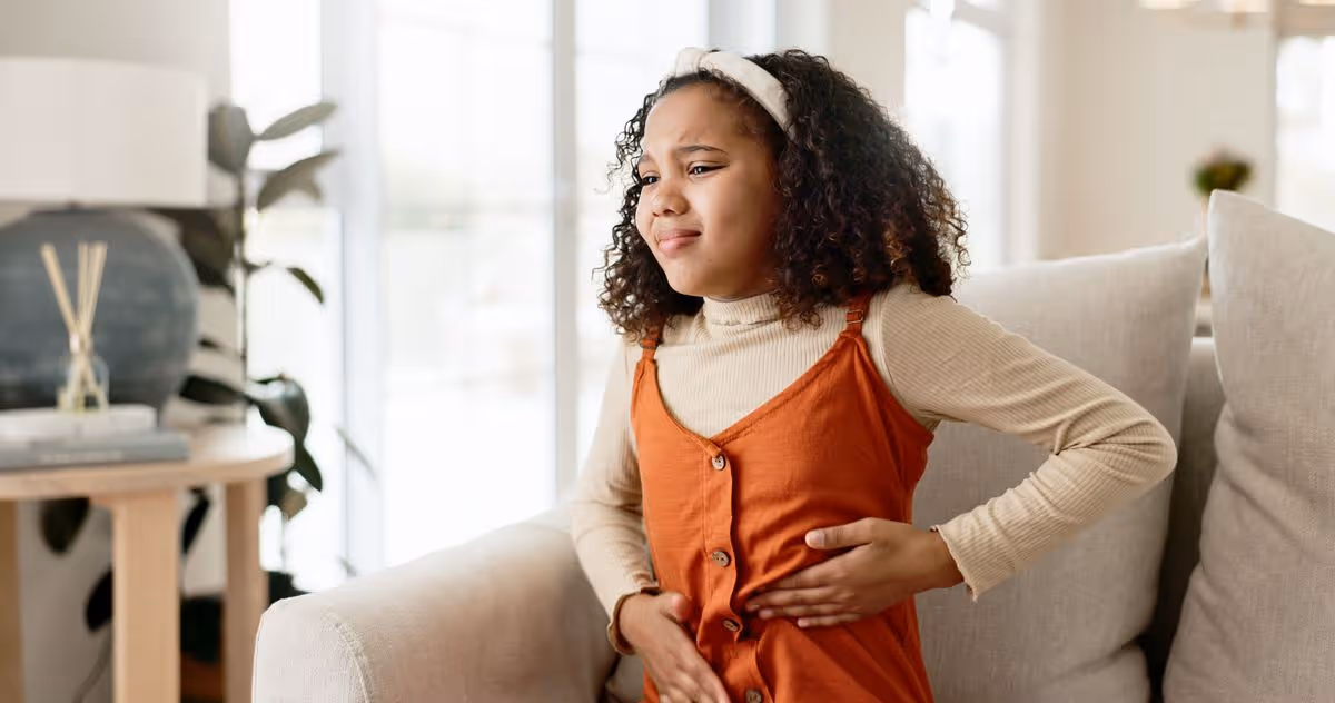 Person experiencing stomach symptoms