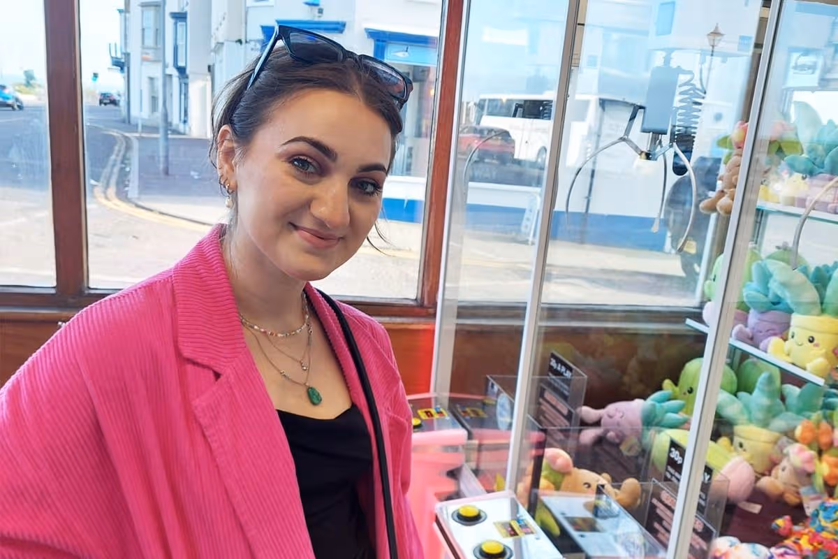 woman in pink coat in amusements