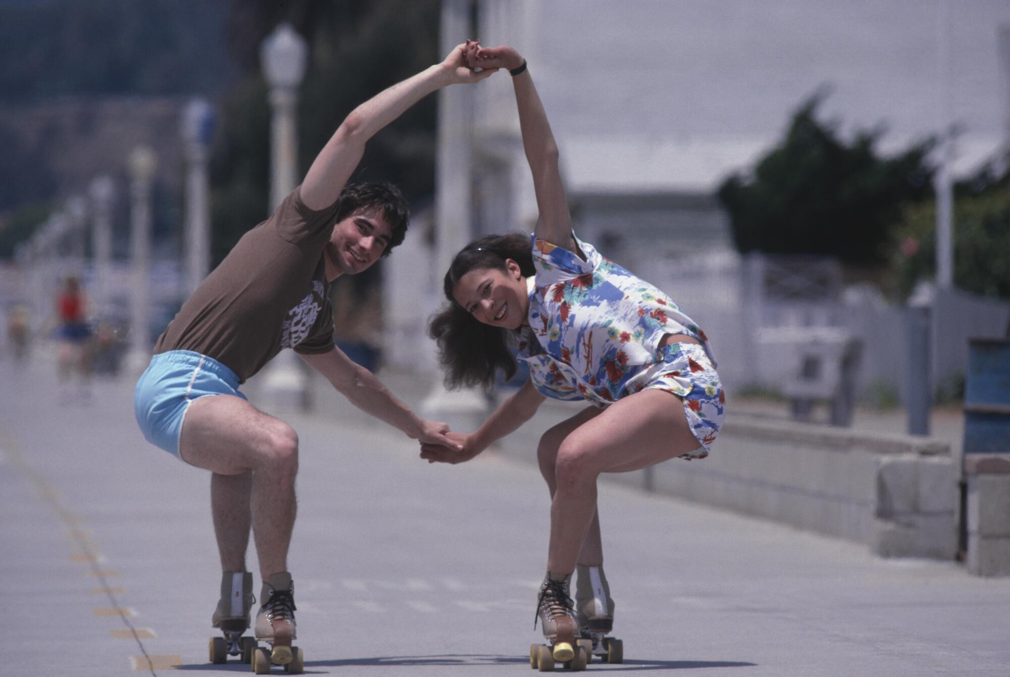 Randy Gardner and Tai Babilonia roller skating together in May 1979.