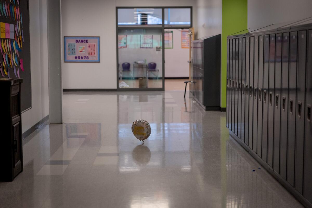 A balloon sits in a hallway at the high school.