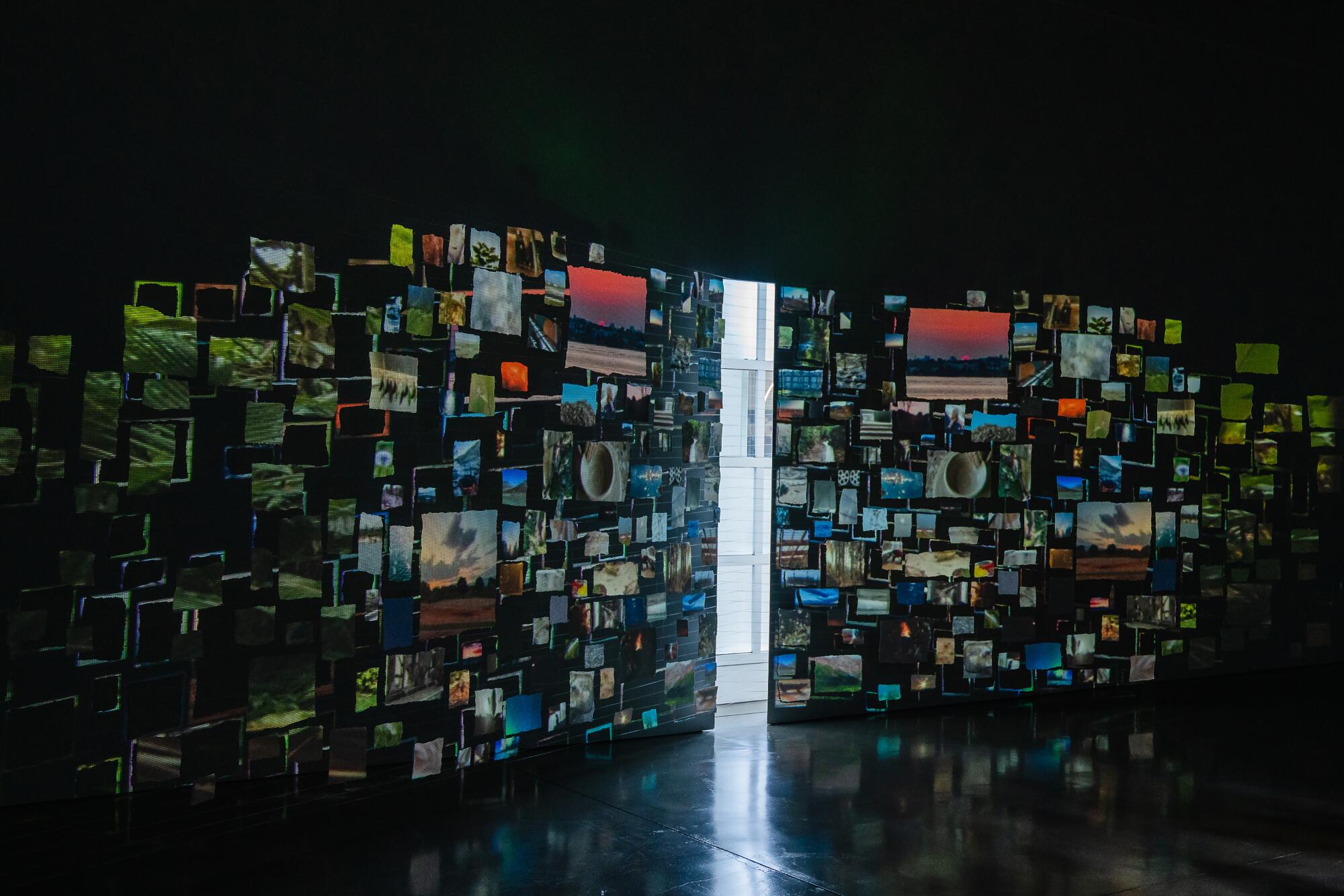 "Sleepers," a video installation, covers the wall of a dark room, with a single gallery window letting light in.