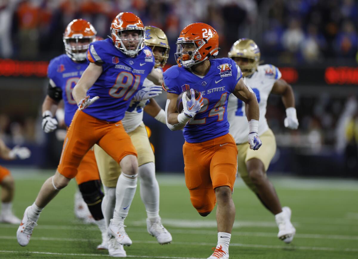 Boise State RB George Holani runs into the secondary at the 2023 L.A. Bowl.