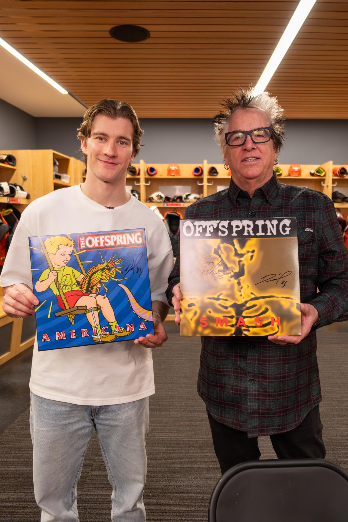 Ducks goalie Lukas Dostal and Noodles hold albums by the Offspring.
