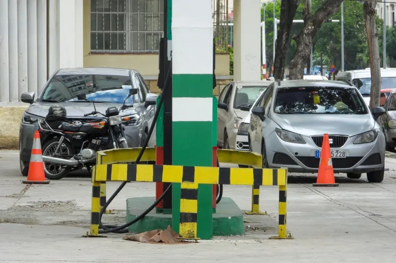 Vehicles wait in line to refuel at a gas station in Havana on January 30, 2026. Cuban President Miguel Diaz -Canel on January 30, 2026, denounced US President Donald Trump's attempt to 