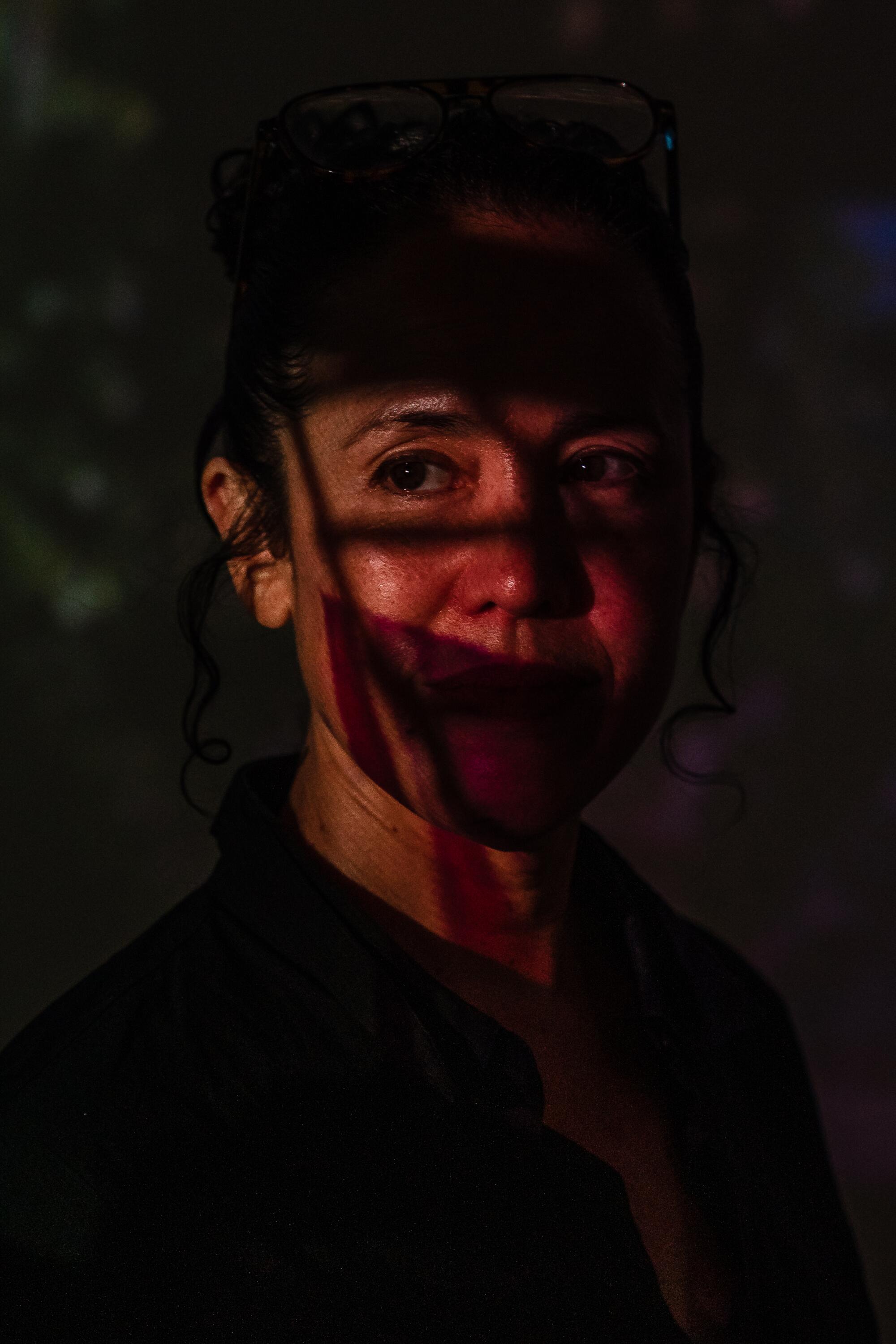 Shadows cross Sarah Sze's face at Gagosian Beverly Hills gallery.